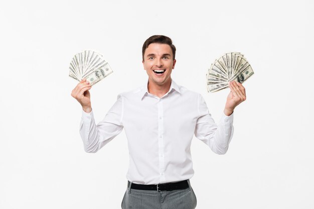 Portrait of a cheerful successful man in white shirt