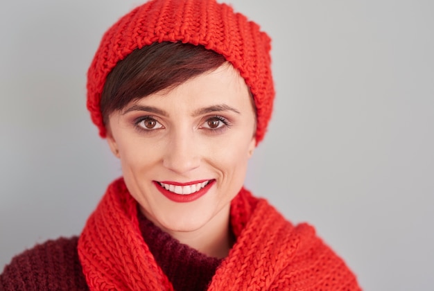 Portrait of cheerful woman in winter clothes