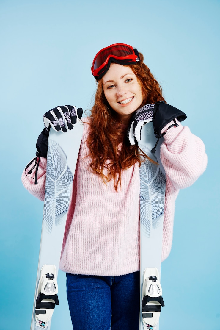 Free Photo portrait of cheerful woman with her skis