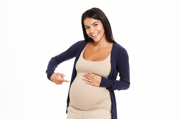 Portrait of a cheerful young pregnant woman