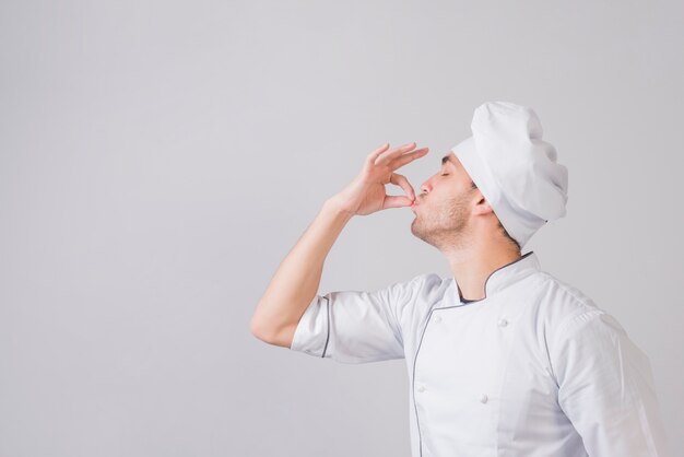 Portrait of chef doing tasty gesture