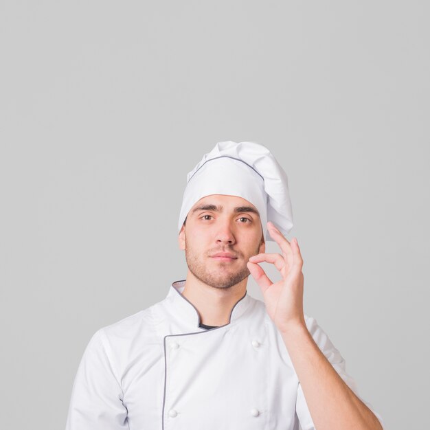 Portrait of chef doing tasty gesture