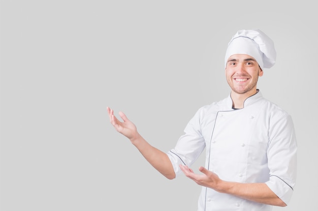 Free photo portrait of chef presenting copyspace