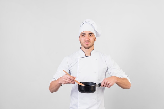 Portrait of chef with pan
