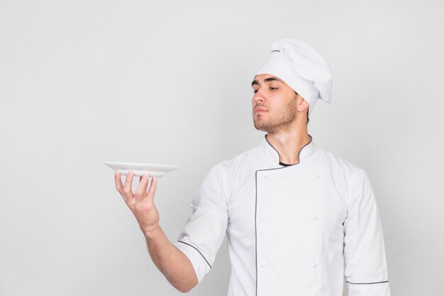 Portrait of chef with plate