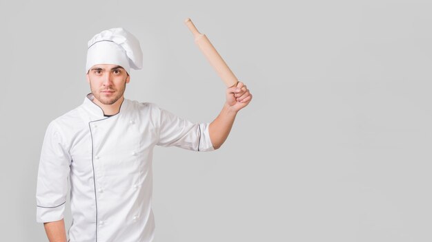 Portrait of chef with rolling pin