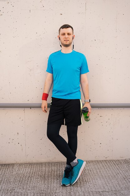 Portrait of city runner with black headphones