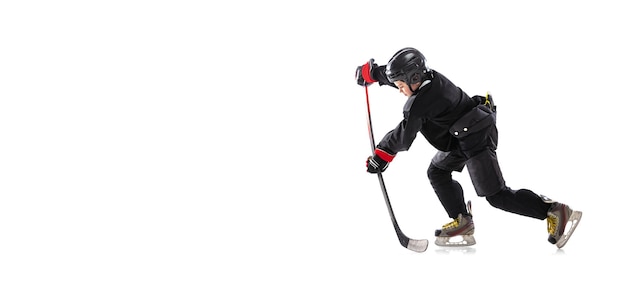 Portrait of concentrated boy child hockey player in motion training isolated over white background Flyer