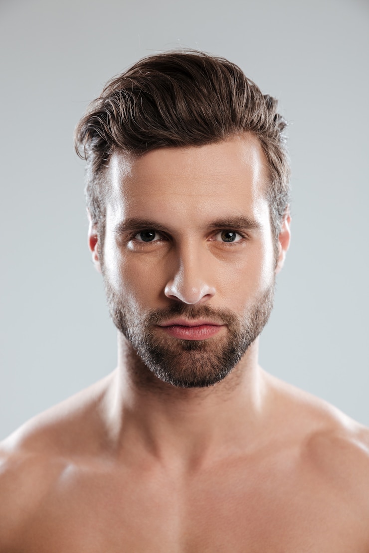 Free Photo portrait of a concentrated young bearded man