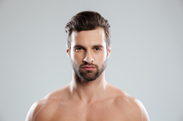 Portrait of a concentrated young bearded man