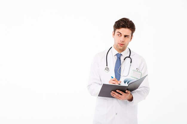 Portrait of a concentrated young male doctor