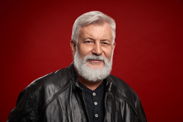 Portrait of confident aged man in black leather jacket