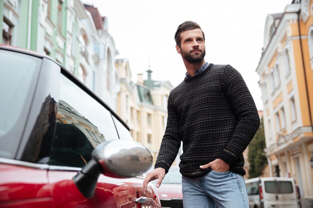 Portrait of a confident bearded man in sweater