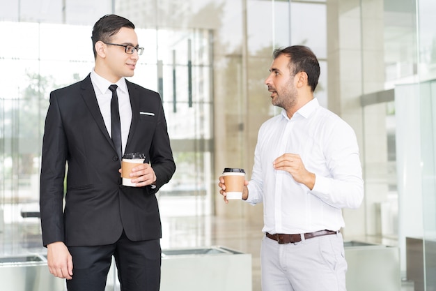 Portrait of confident businessman meeting at coffee break