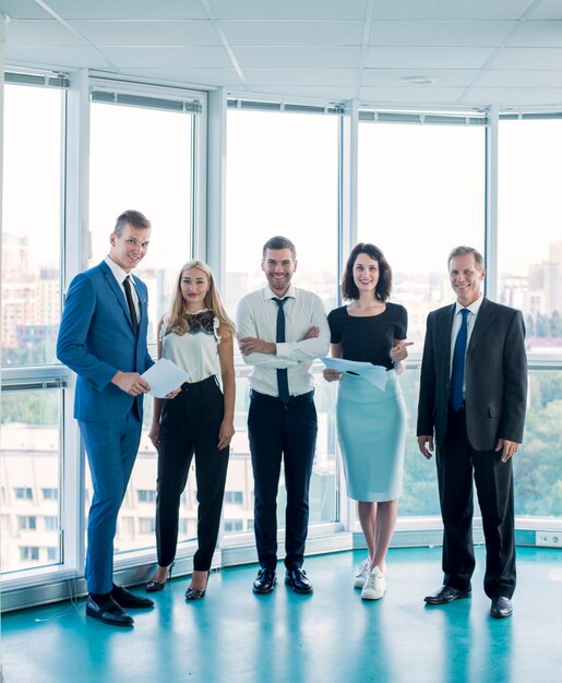 Portrait of confident businesspeople standing in office