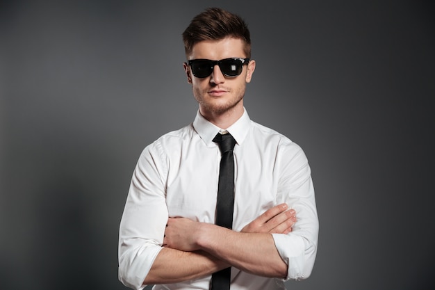 Portrait of a confident man in shirt and tie standing