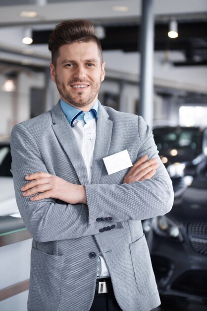 Portrait of confident mid adult salesman