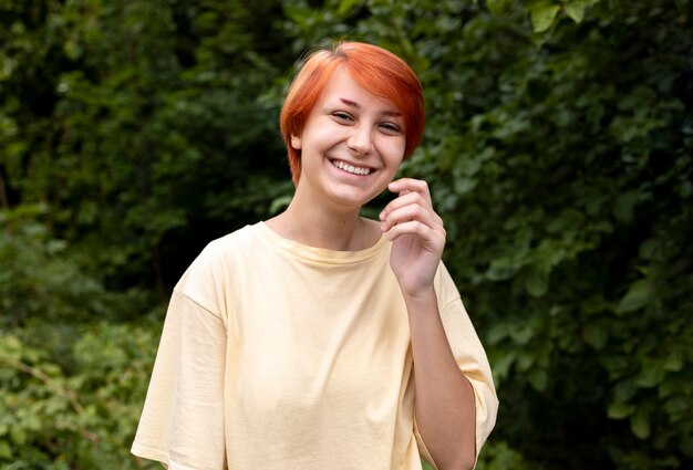 Portrait of confident redhead girl outdoors