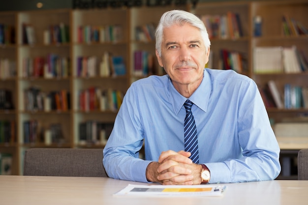 Portrait of confident senior businessman in office