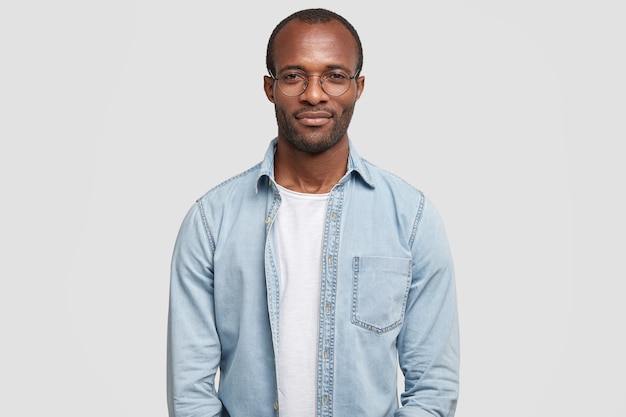 Portrait of confident successful businessman dressed in casual denim shirt