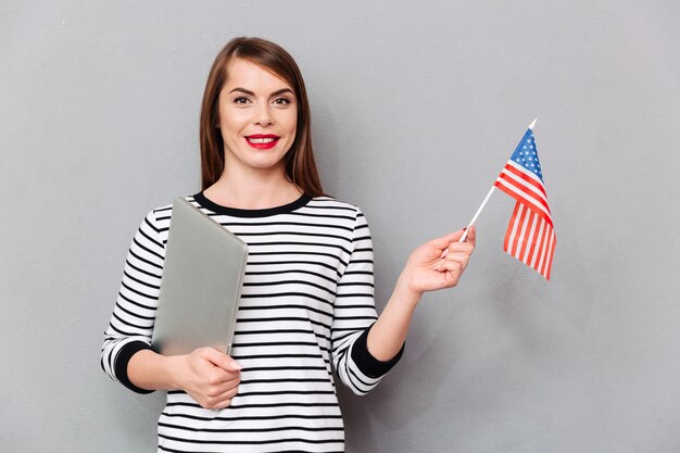 Portrait of a confident woman holding american flag