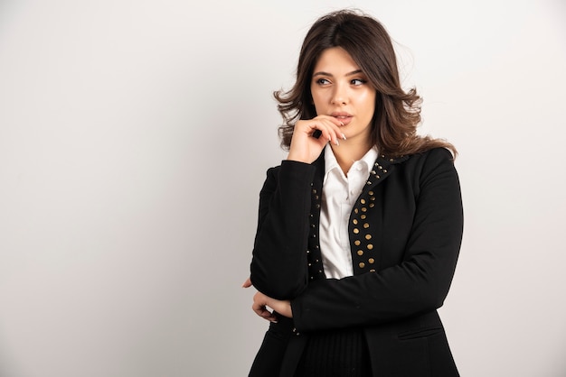 Portrait of confident woman posing on white.