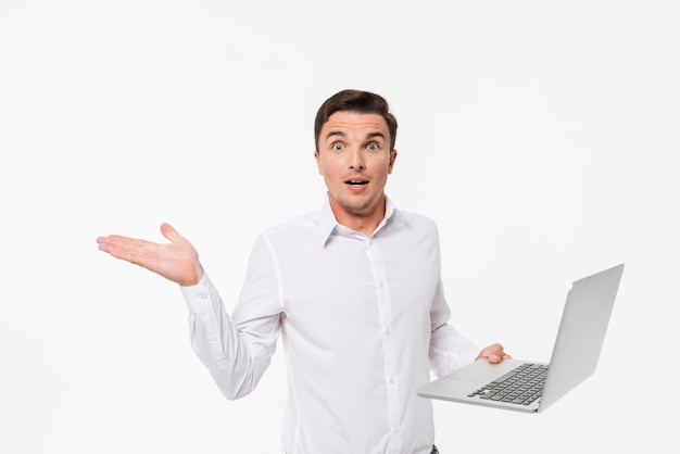 Portrait of a confused frustrated man in white shirt