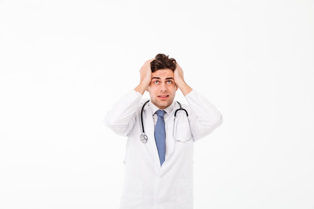 Portrait of a confused worried young male doctor man