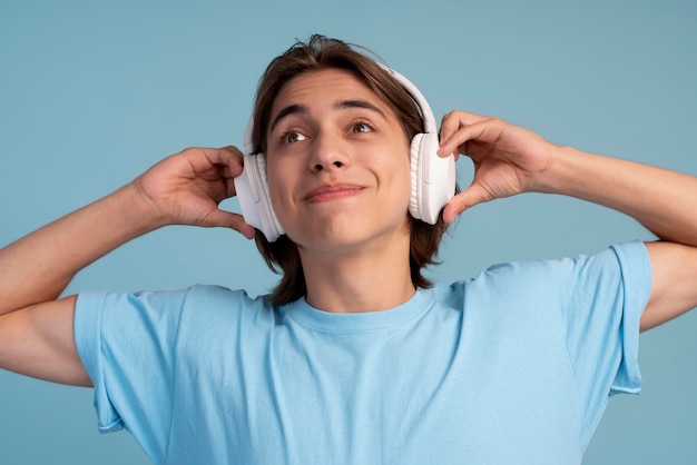 Portrait of cool teen boy listening to music