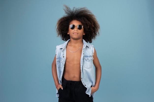 Free photo portrait of cool teenage boy wearing jean jacket