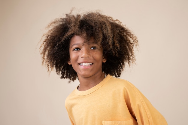 Free photo portrait of cool teenage boy with perm