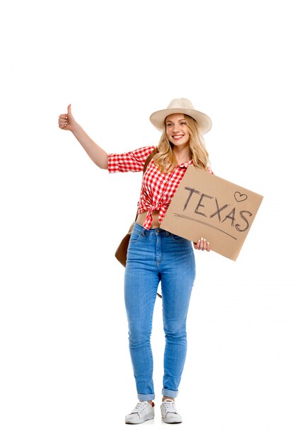 Portrait of country woman hitchhiking on white.