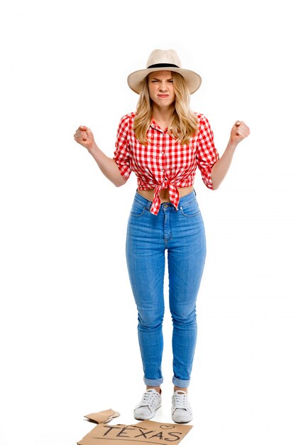 Portrait of country woman hitchhiking on white.