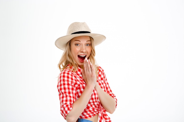 Portrait of country woman surprised on white.