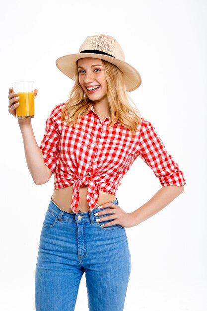 Portrait of country woman with juice on white.