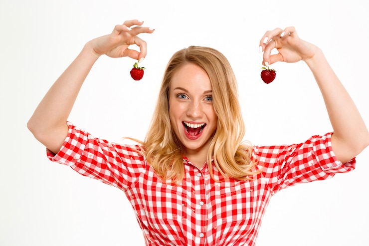 Free Photo portrait of country woman with strawberry on white.