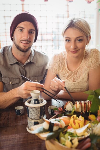 Portrait of couple having sushi