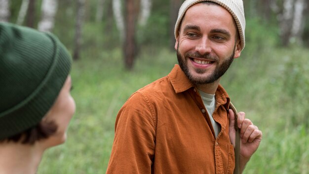 Portrait of couple looking at eachother in nature