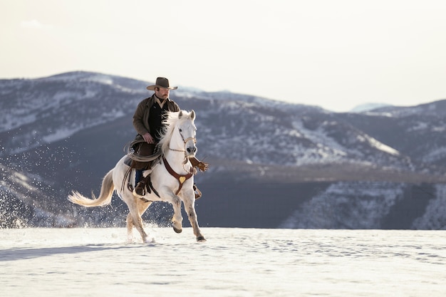 Free photo portrait of cowboy on a horse