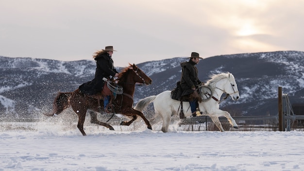 Free photo portrait of cowboys on horses