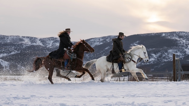 Portrait of cowboys on horses