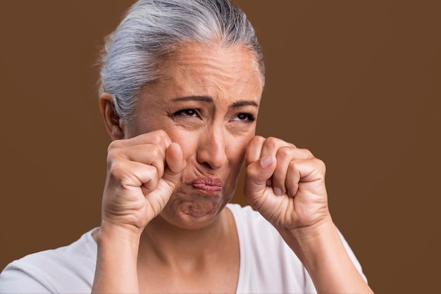 Free photo portrait of crying older woman