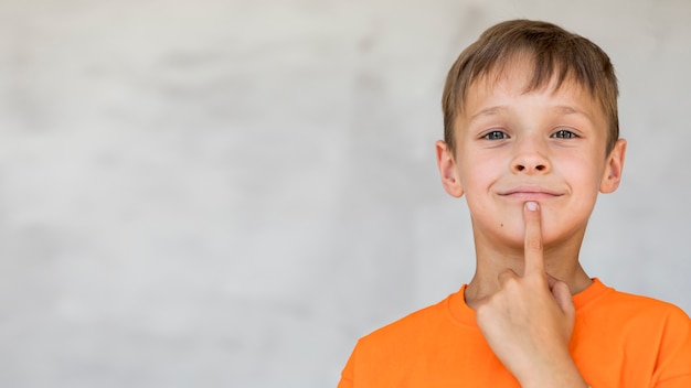 Portrait of curious boy with copy space