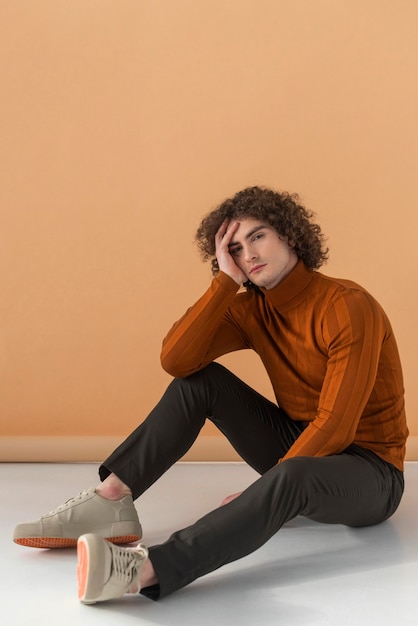 Free photo portrait curly haired young man