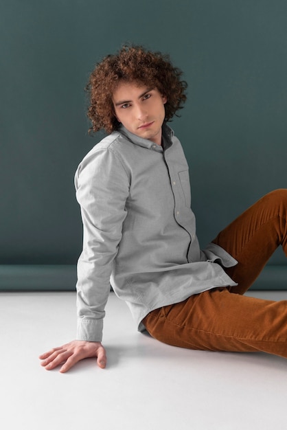 Free photo portrait curly haired young man