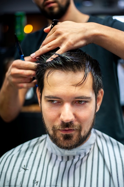 Portrait of customer getting a haircut