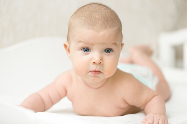 Portrait of a cute baby making questionable funny face