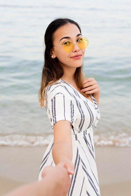 Portrait of cute girl holding boyfriends hand