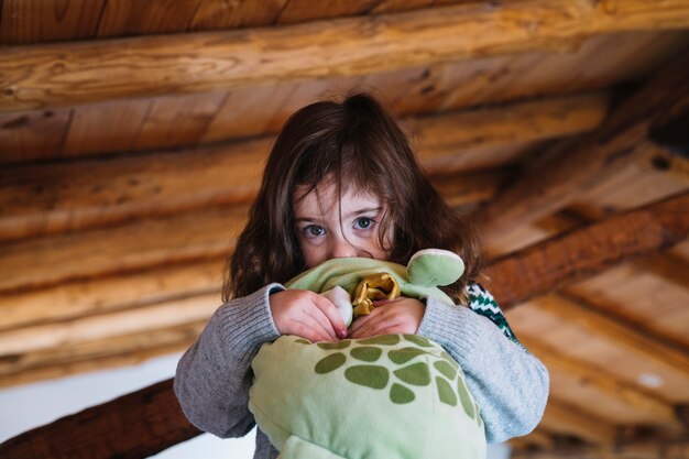portrait of a cute girl with soft toy