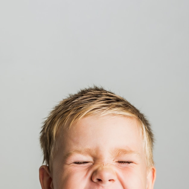 Portrait of cute kid with blonde hair